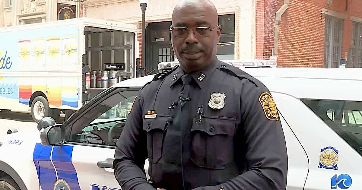 When a flooded sinkhole began swallowing a woman's car, a quick-thinking officer gave a 3-word command to bystanders