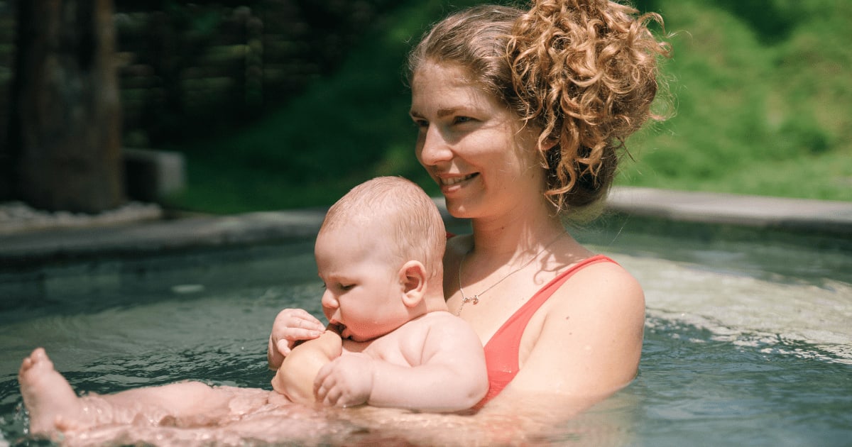 Video of mom pushing her fully clothed 1-year-old into a pool is dividing the internet — she says it's not what it looks like at all