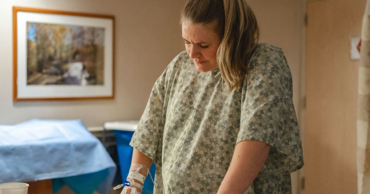 Doctor told a woman in labor to 'compose herself' as she cried beside her late husband's urn. One contraction later, she sat up and fired back