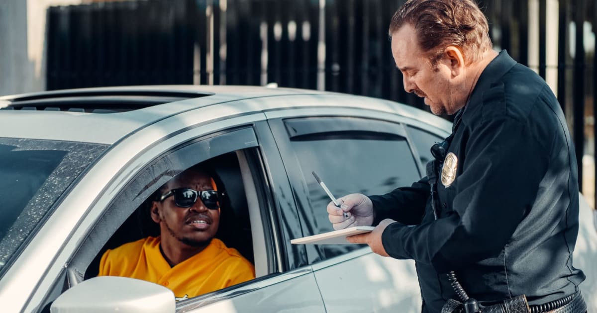 Pickup truck driver honked for 5 seconds straight when he refused to block an intersection, then reversed toward him. He didn't see the motorcycle cop