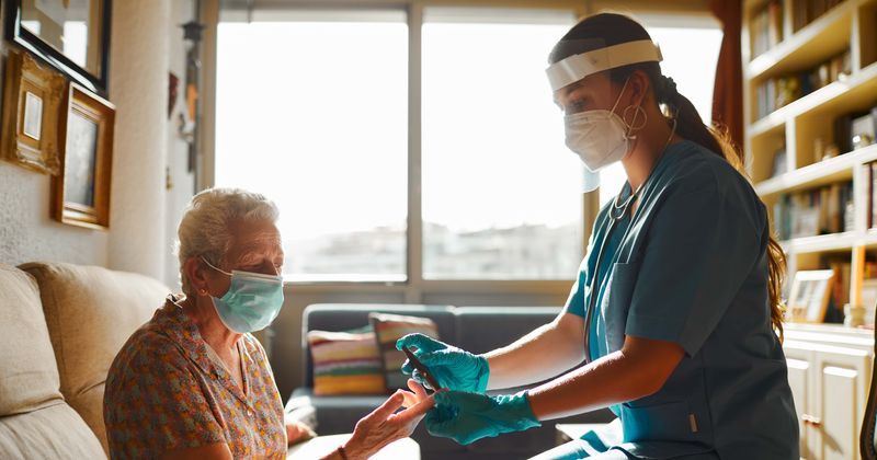 She couldn't see her dad because of the pandemic. So she took a job at his nursing home.