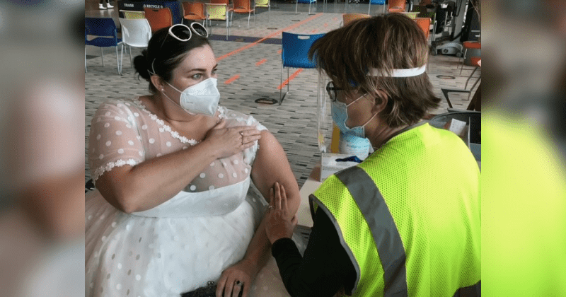 Bride who had to cancel her reception due to COVID-19 wears wedding dress to vaccine appointment