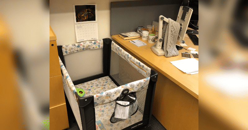 Professor sets up a crib in office for grad student's baby