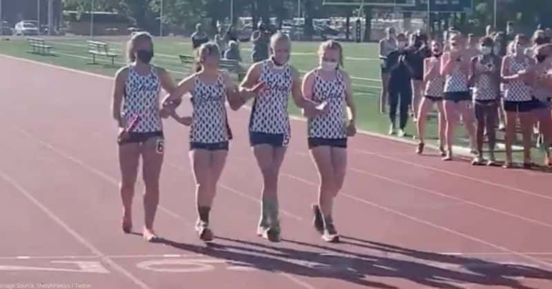 A runner with cancer crossed the finish line at her last school track meet with her teammates