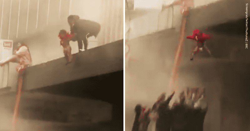 Mom throws baby off a burning building into strangers' arms to save her in heartstopping moment