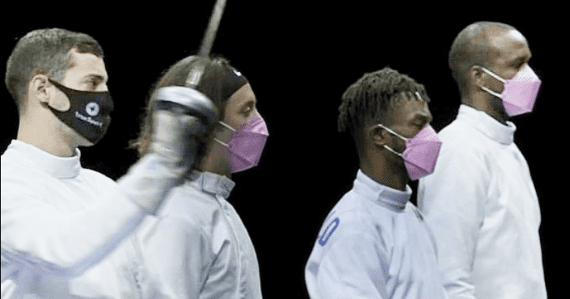 US fencers wear pink masks to protest teammate accused of sexual assault—standing right next to him