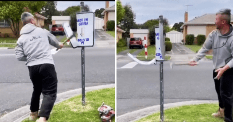Man tears down racist sign with a sledgehammer