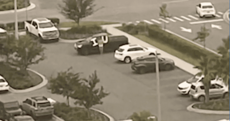 Devoted husband holds 'I love you' sign outside wife's ICU window for 10 days as she fights COVID-19