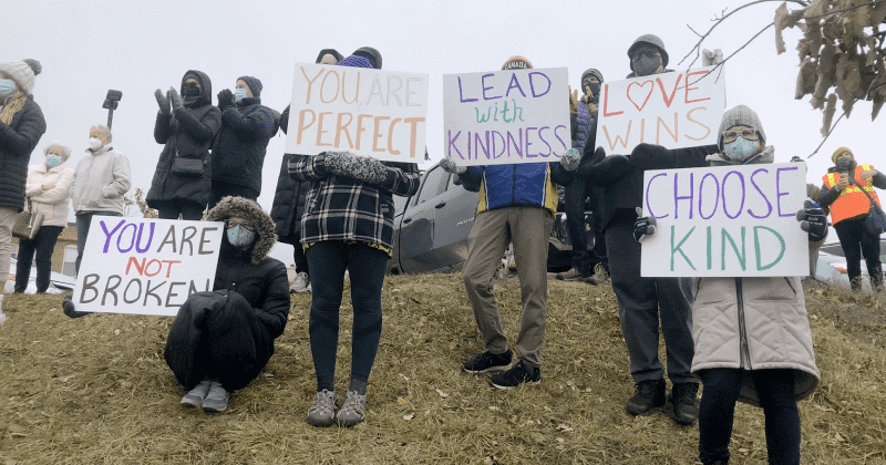 Hundreds take to streets to support trans kid outed by their mom's opponents in bitter election