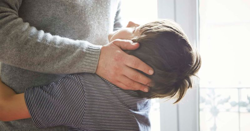 Ukrainian father gives his son Batman toy and a message before he goes back to fight: 'Be brave'