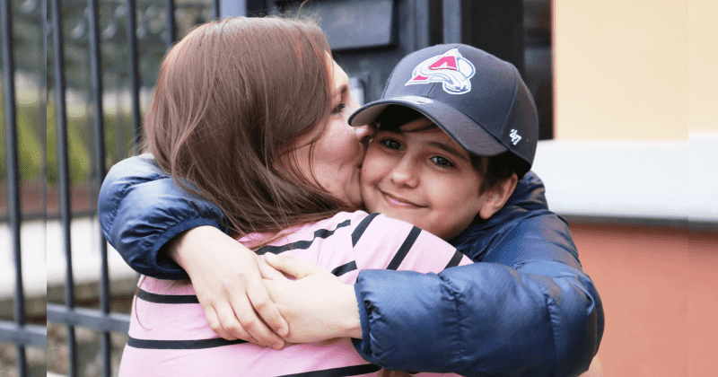 Boy who fled Ukraine with just a phone number written on his hand reunites with mom