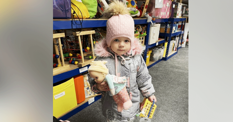 Ukraine girl overjoyed at finding the same doll she left at home in Ukraine from a charity