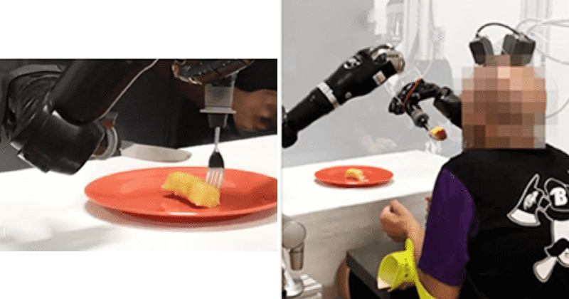 Paralyzed man uses robotic arms to feed himself for first time in 30 years