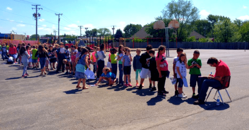 Kids line up for their beloved janitor to sign the yearbooks: 'He's a role model' 