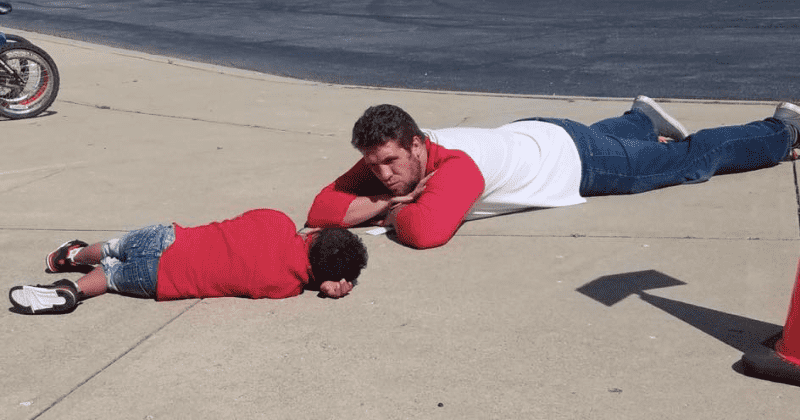 Teacher gets down on the ground to help a boy with autism navigate a breakdown