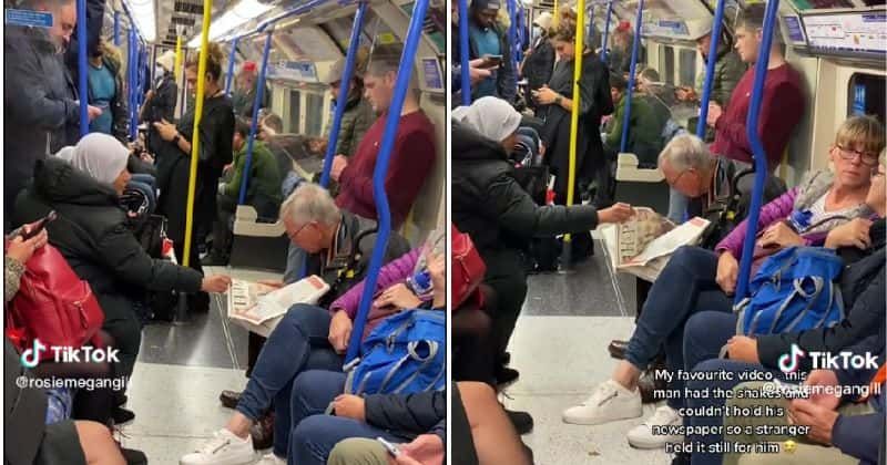 Kind stranger on train helps elderly Parkinson’s patient read newspaper by holding it still for him