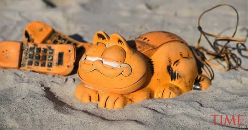 Garfield phones have been washing up on French beach for 35 yrs and the mystery has been finally solved