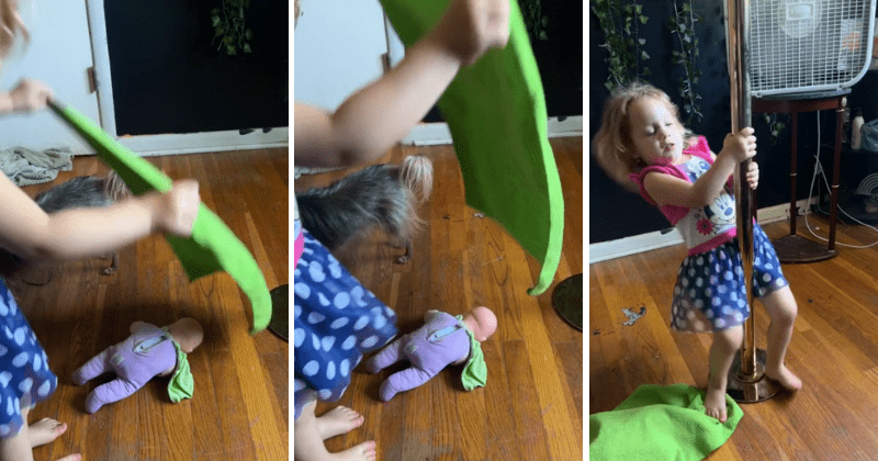 Cute toddler mimicking mother's pole dance moves hilariously covers her doll's face with blanket