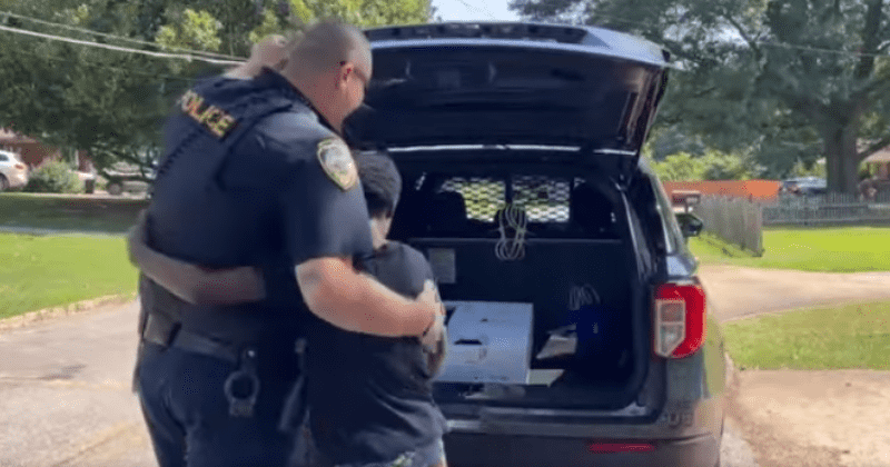 Police officer surprises young boy with a PS5 after he was reported for doing yard work for money