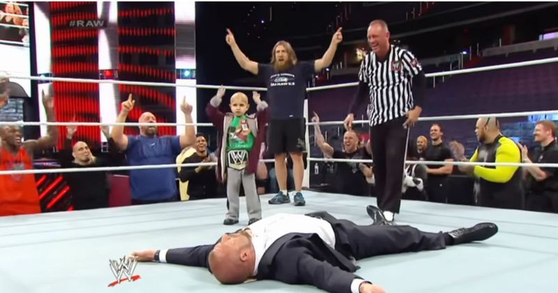 Triple H lets kid battling cancer beat him up inside WWE ring to fulfill the child's special wish