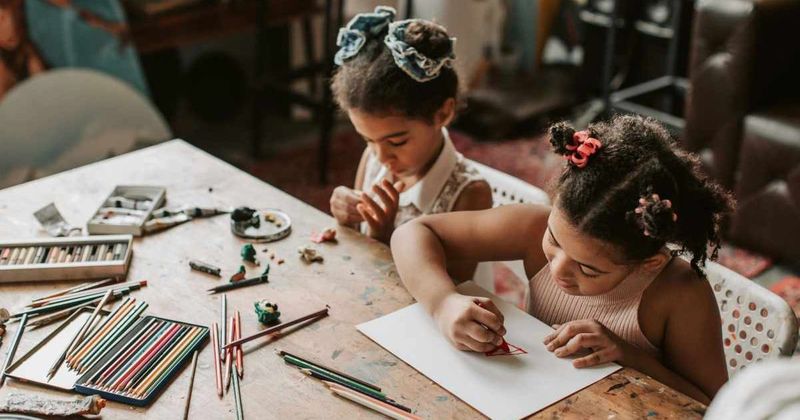 Little girl performing on stage spots her little sister using her coloring book and her reactions are priceless