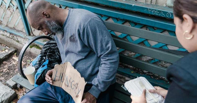Woman buys dinner for a homeless man and then makes a gesture that shows kindness has no limits