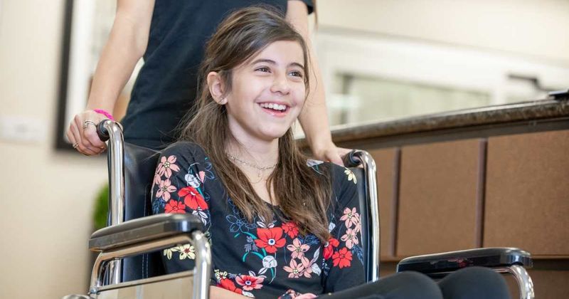 After 1 year in a wheelchair, she walked again in front of her parents — and they lost it