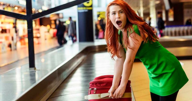 Woman wrestles 'thief' trying to steal her luggage. When she sees who it actually is, she can't stop laughing
