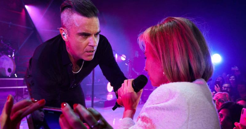 Superfan shouted her phone number to Robbie Williams on live TV 30 years ago. He just saw it and called her