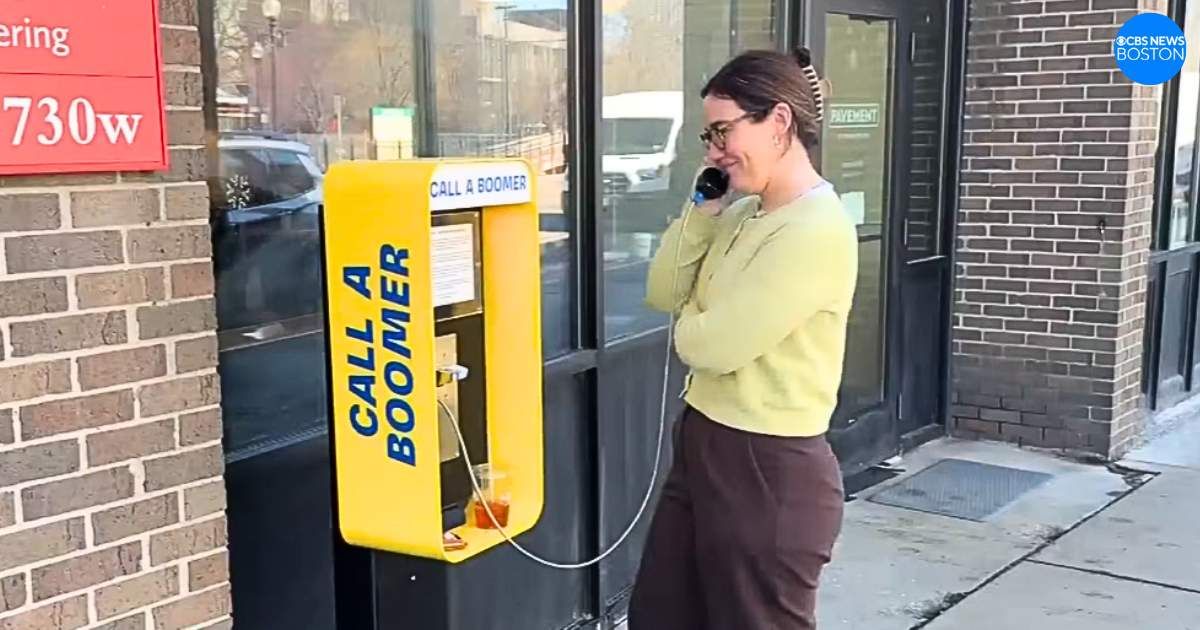 An old-school payphone in Boston is helping Gen Z fight loneliness by letting them 'call a Boomer'