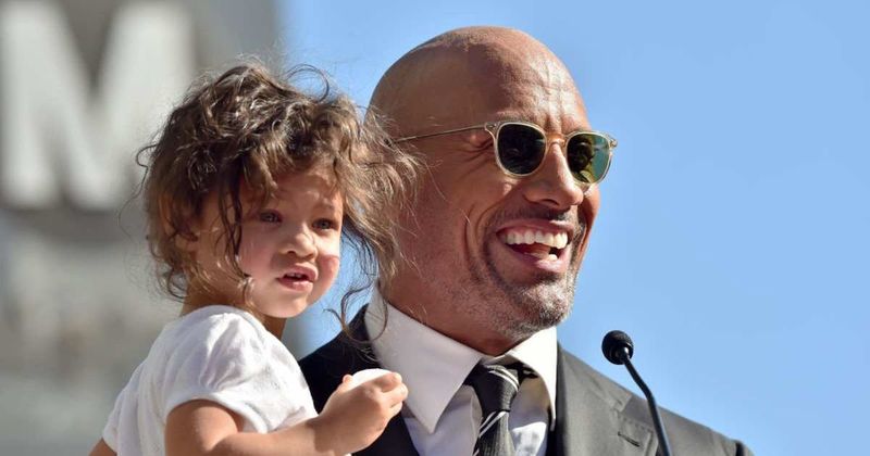 The Rock has unusual advice for new dads: take off your shirt when the baby arrives