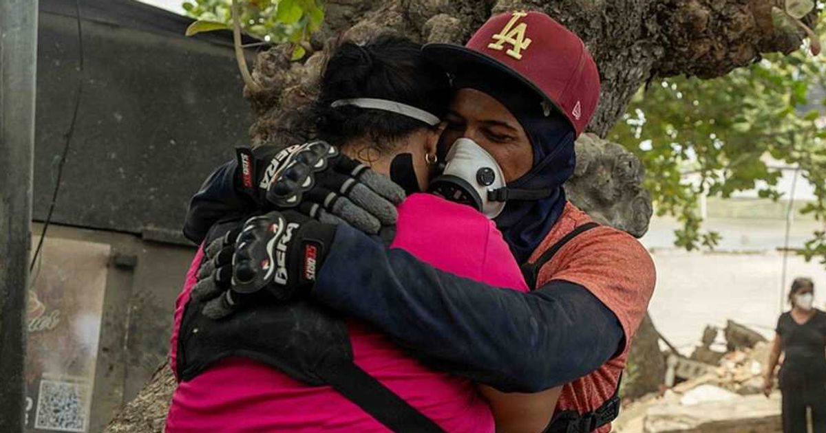 After escaping a collapsed house, he went back to rescue his wife. They argued the whole time