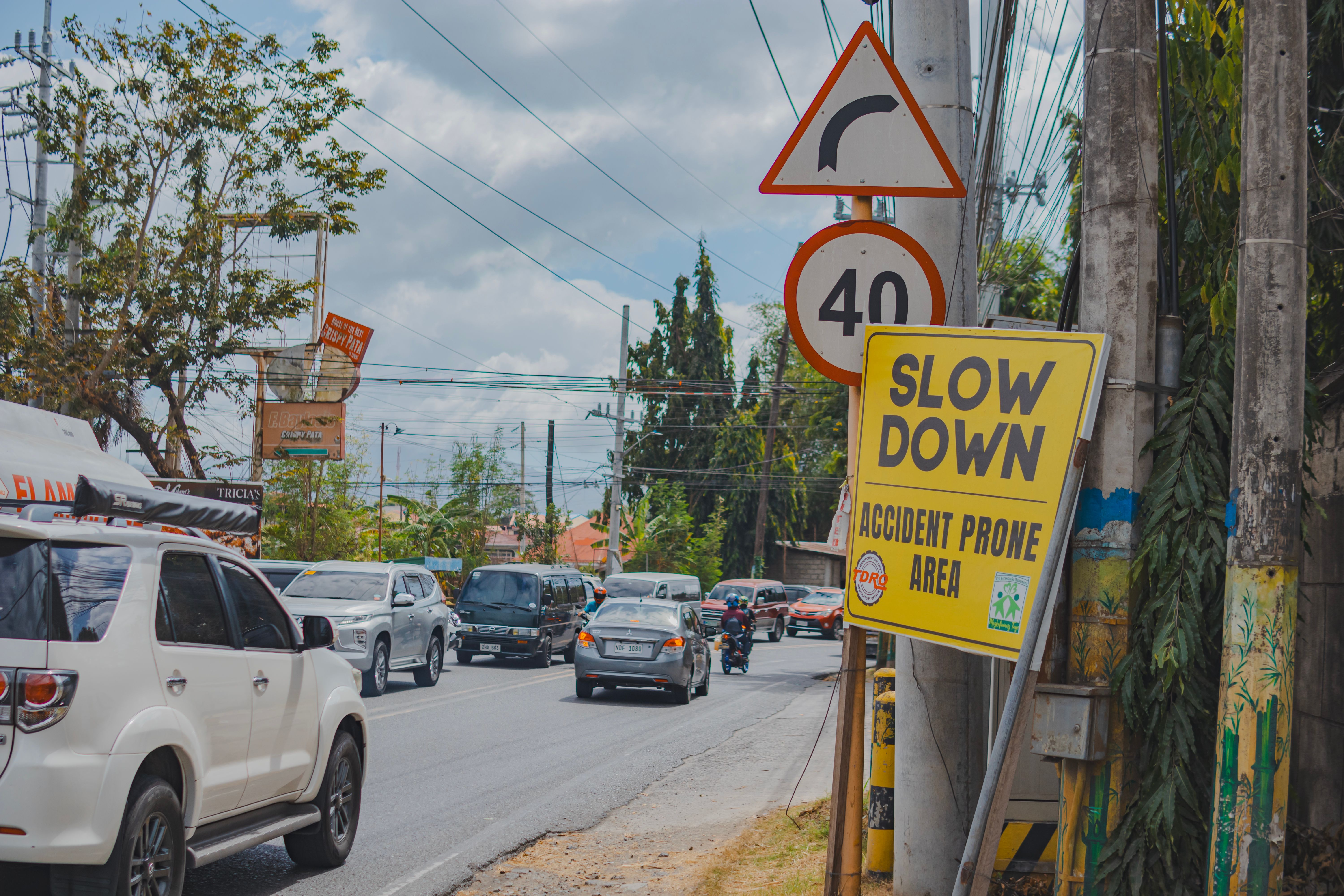 Heavy urban traffic on a city street with visible road signs. (Representative Cover Image Source: Pexels | Photo by Nothing Ahead)