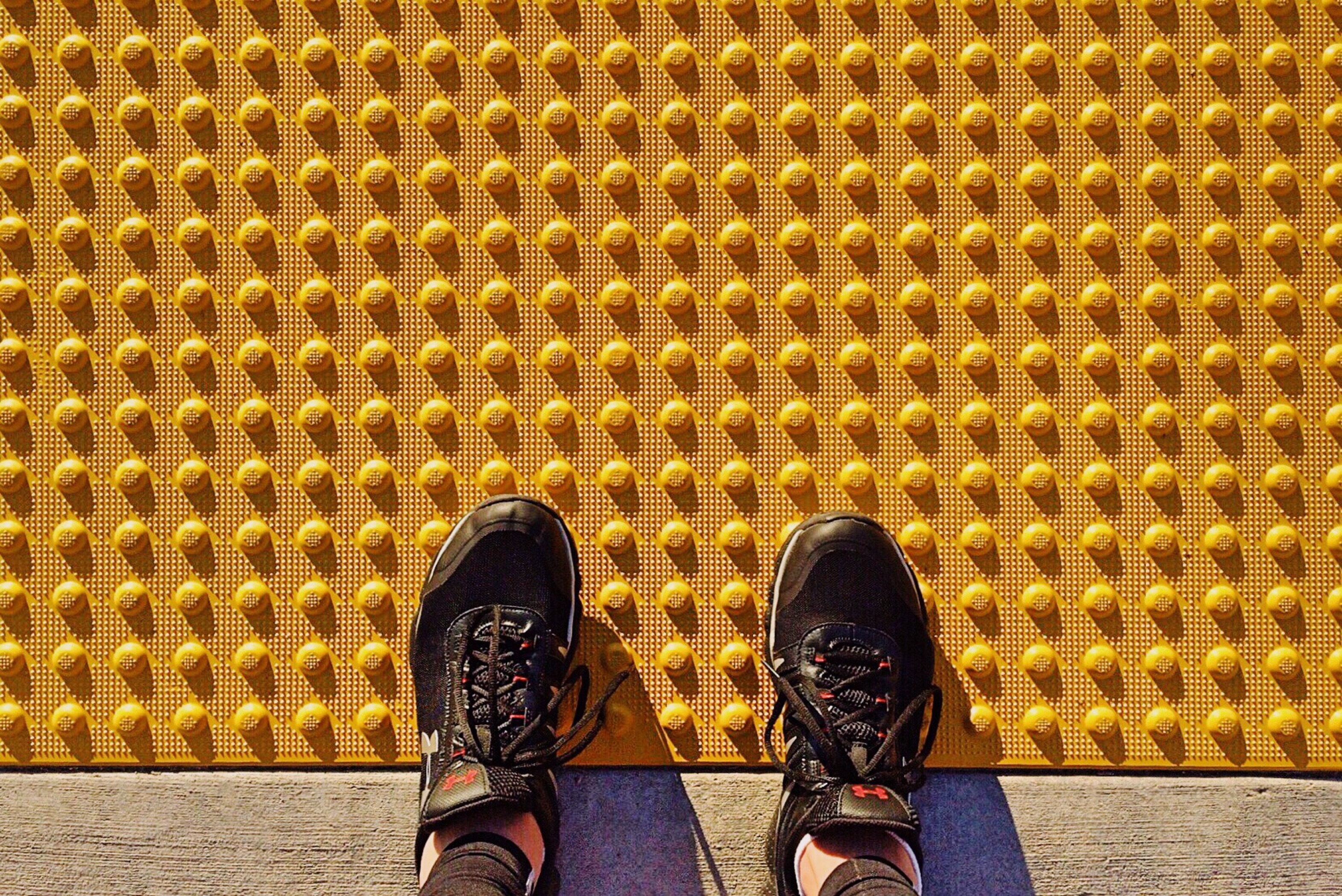 Shoes of a person walking on yellow tactile paving (Representative Image Source: Pixabay | Photo by )