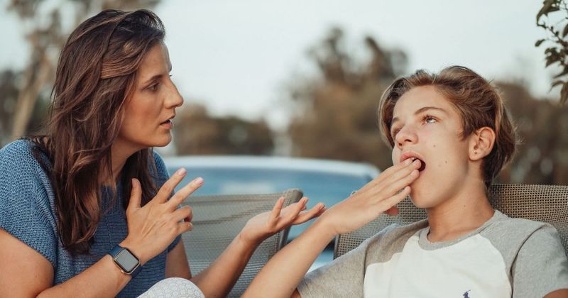 Mom is making her son sell his Xbox, phone, and bike to pay for punching a hole in a hotel wall in anger — dad thinks she's gone too far