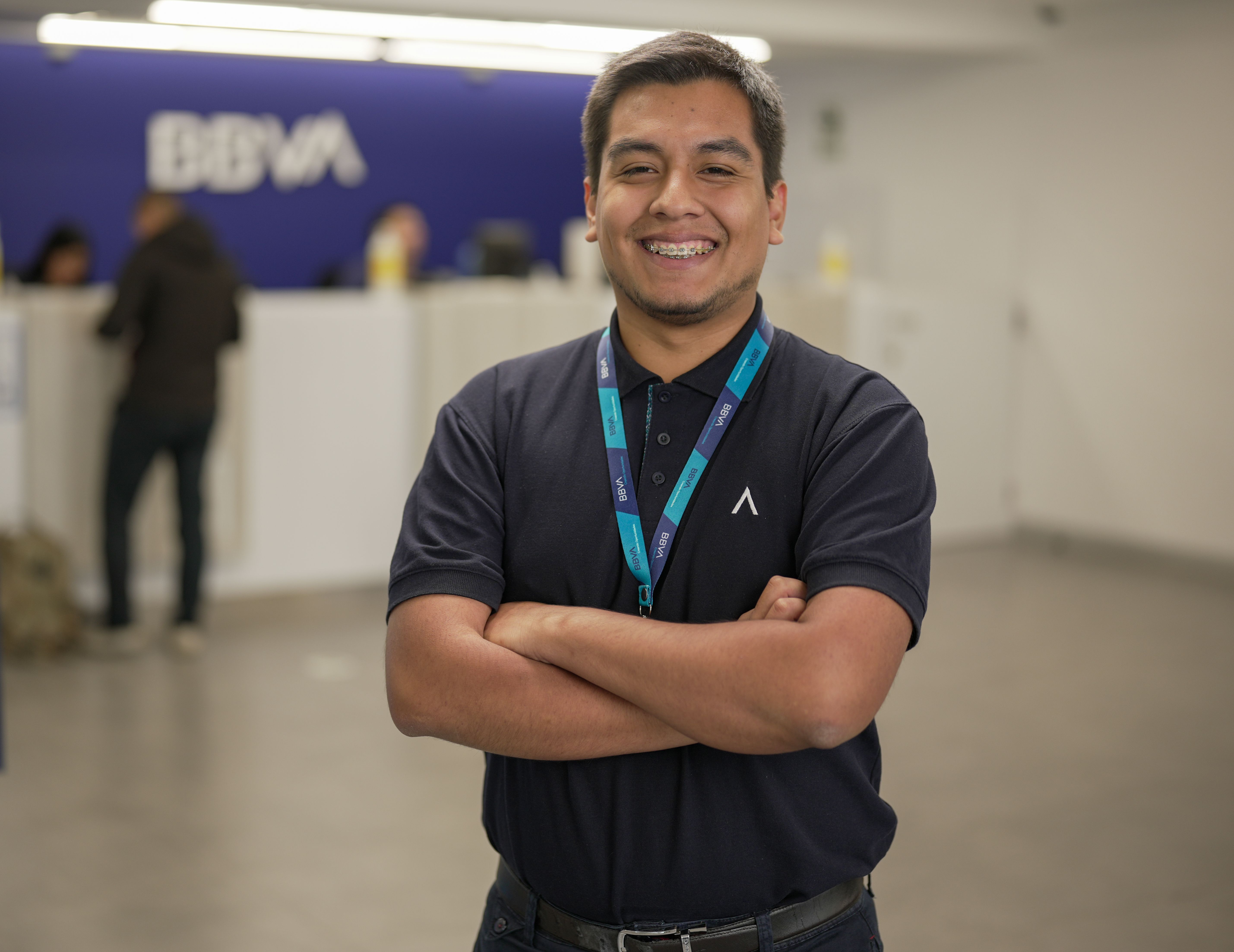 Bank employee standing with a smile (Representative Image Source: Pexels | Photo by )