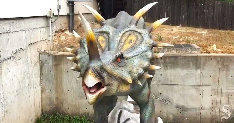 HOA threatened to sue him over a life-like dinosaur in his yard, so he moved it — and accidentally built one of Austin's biggest roadside attractions