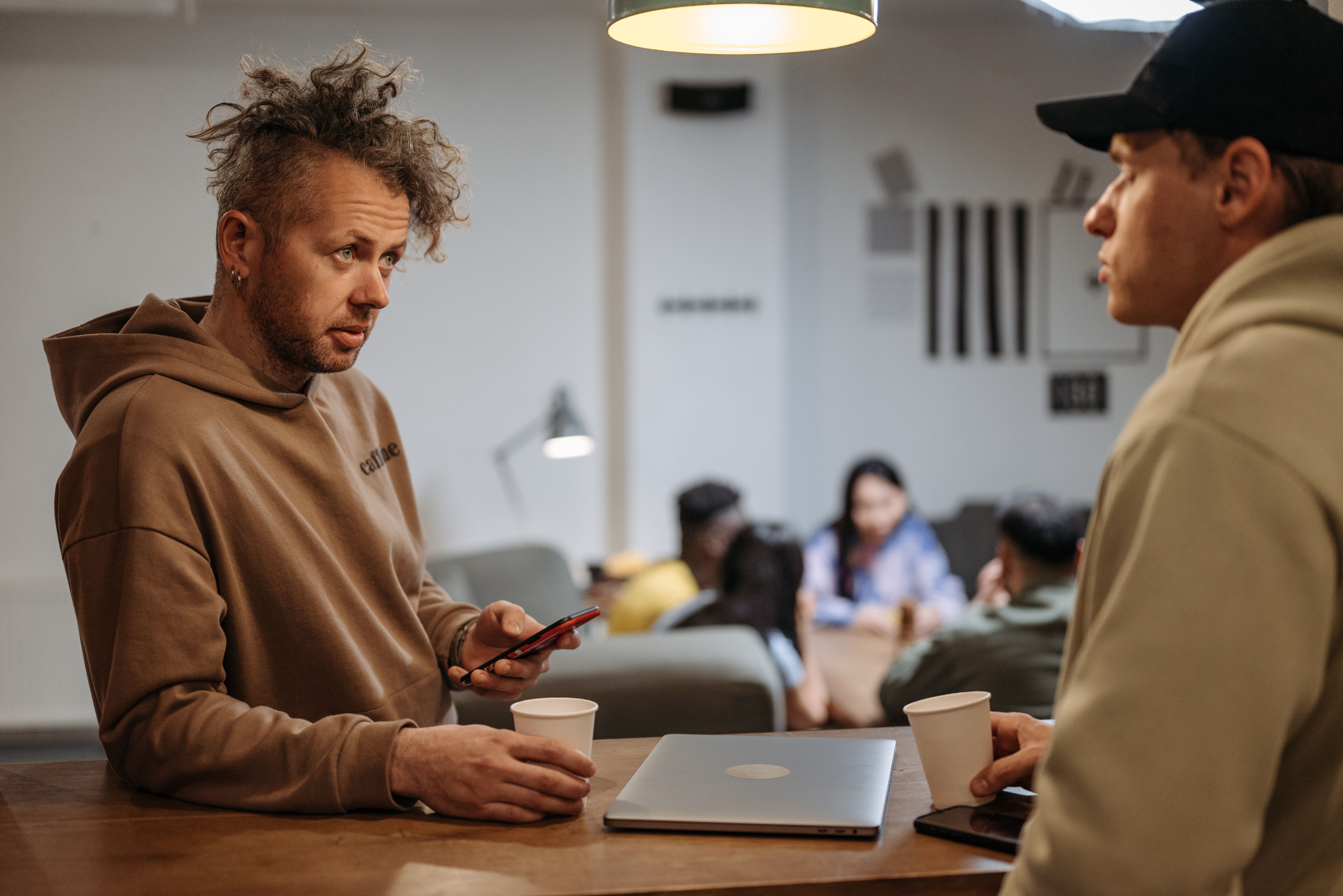 Two men sitting in a coffee shop (Representative Image Source: Pexels | Photo by Pavel Danilyuk)