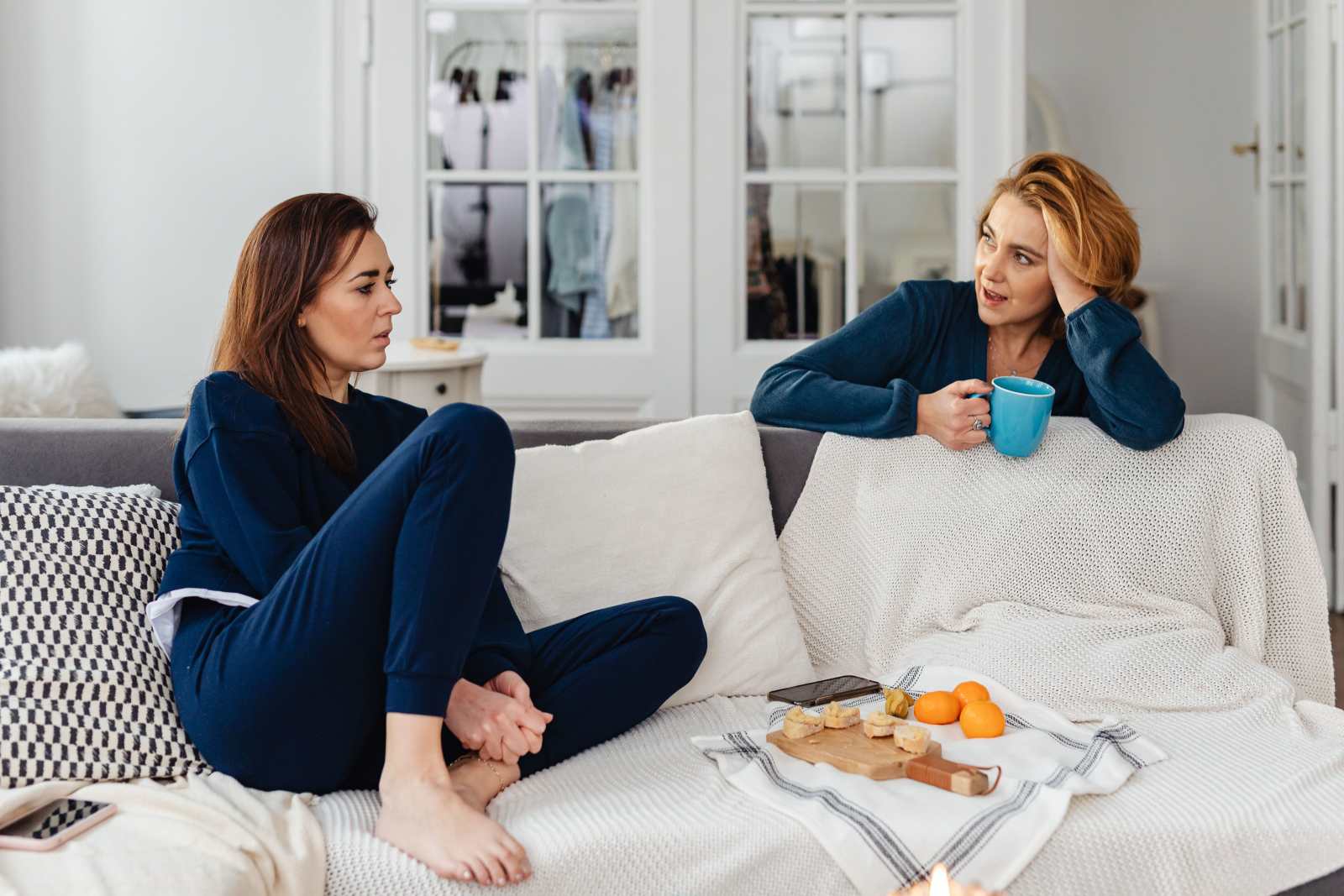 Two women are having a serious discussion. (Representative Image Source: Pexels | Photo by https://kaboompics.com/)