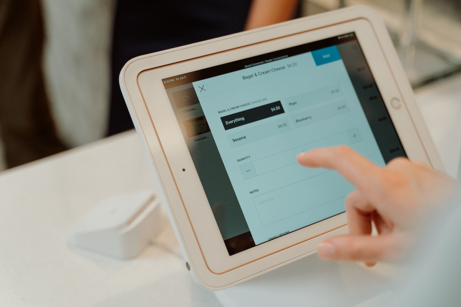 Customer operating a self-service checkout kiosk in a restaurant (Representative Image Source: Pexels | Photo by RDNE Stock Project)