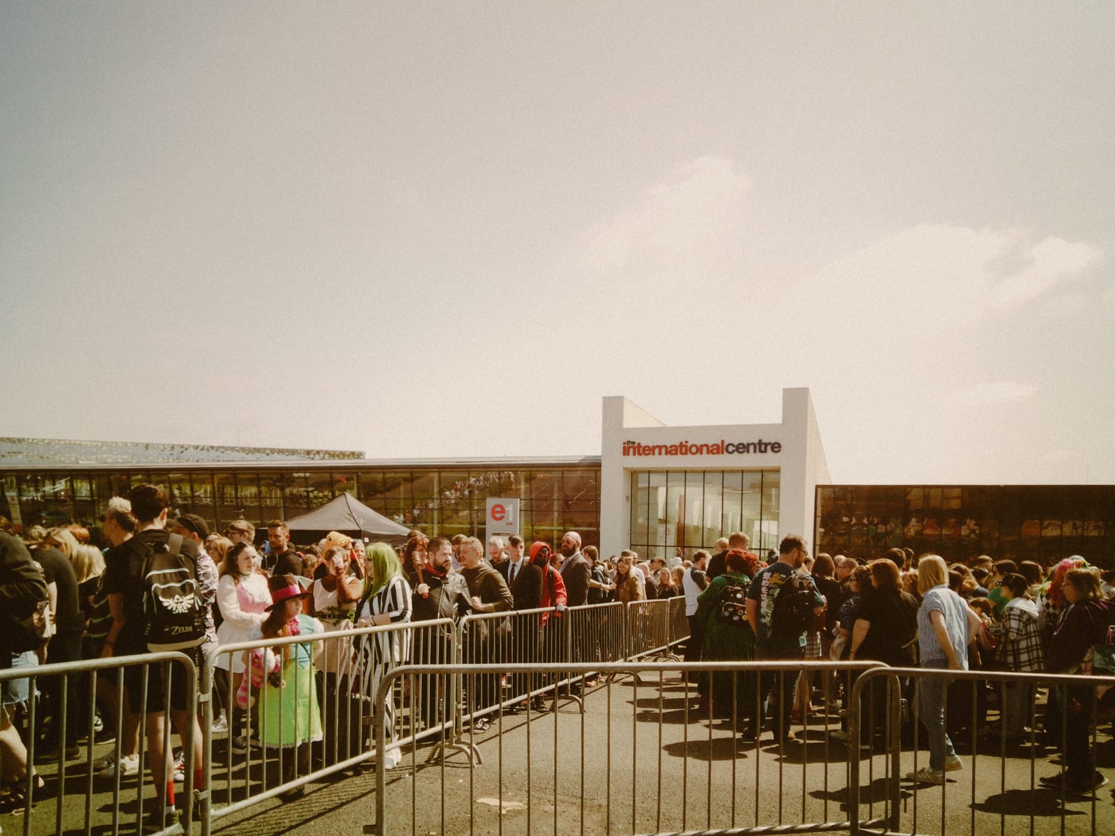 A large crowd is gathering outside the International Centre under sunny skies. (Representative Cover Image Source: Pexels | Photo by Lisa from Pexels)