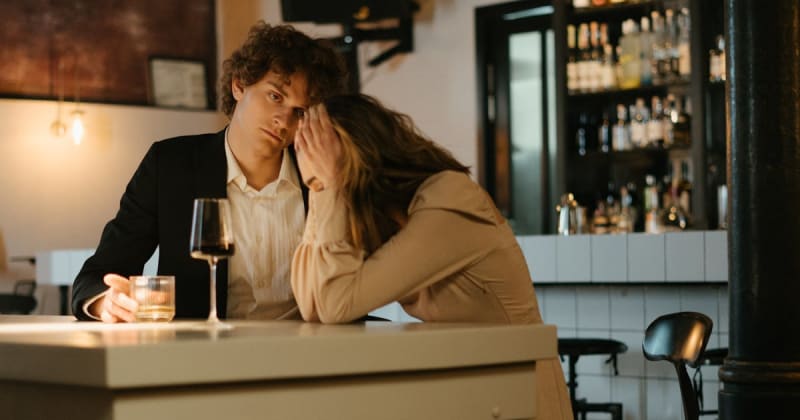 She was boyfriend's plus one but they broke up a month before his sister's wedding. He invited her again just to reject her