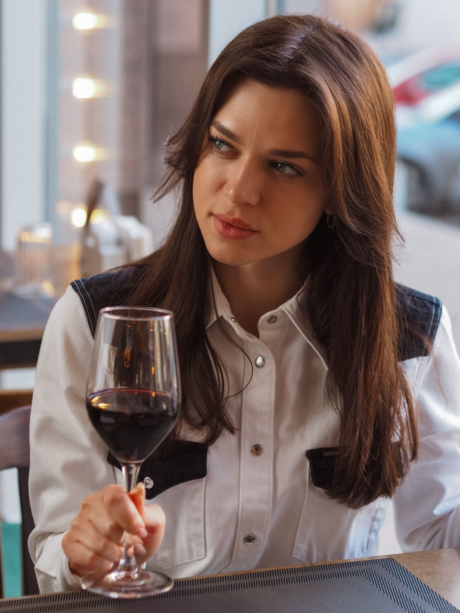 A woman looking skeptical during a dinner date.