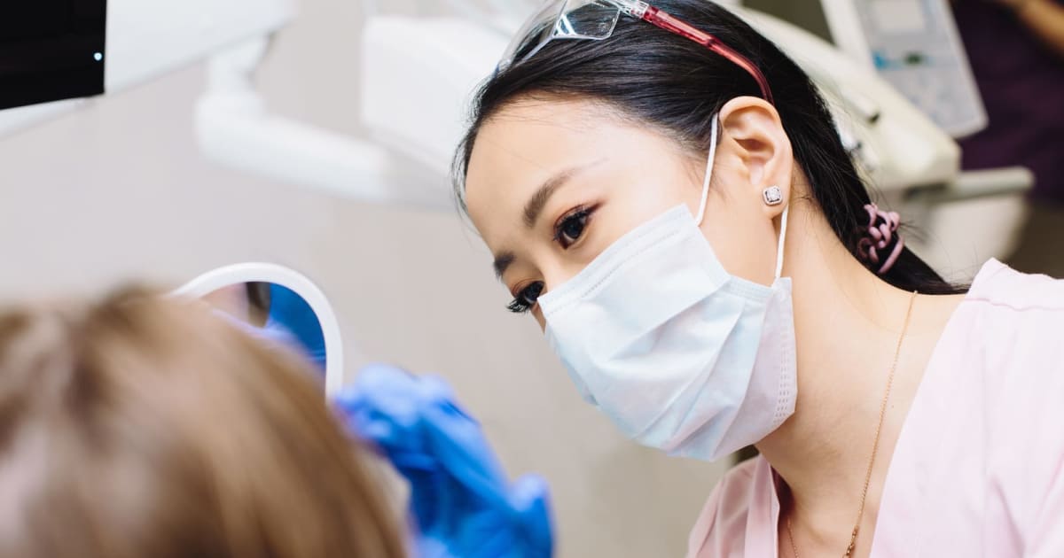 Patient asked a young woman in pink scrubs where the dentist was 3 times. It took a 2-minute extraction to convince him it was her