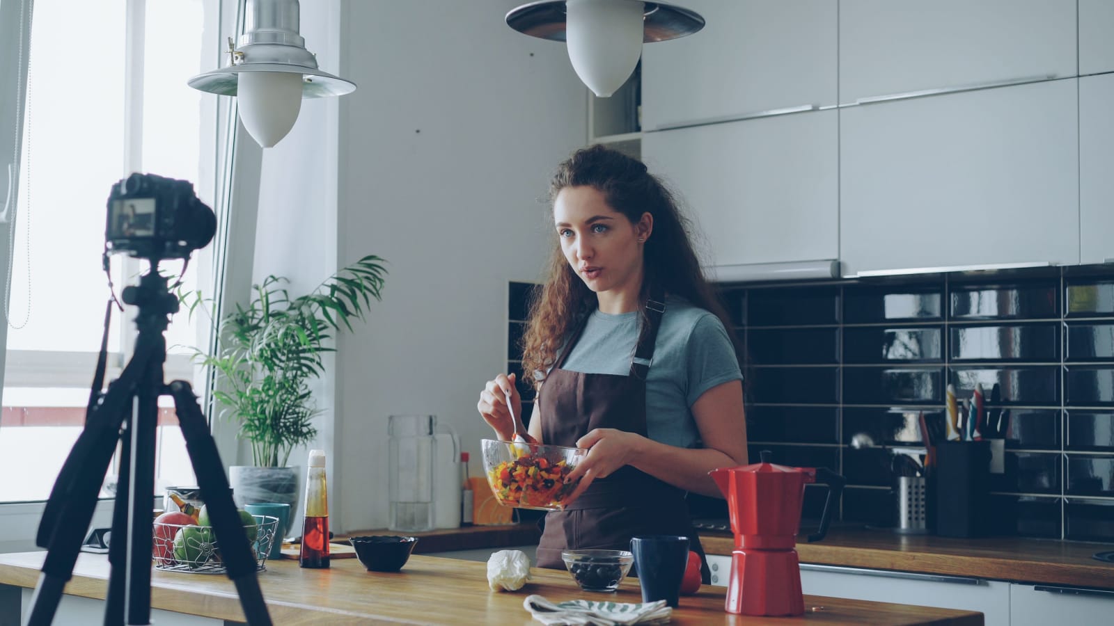 Pretty woman recording a video tutorial on camera (Representative Image Source: Pexels | Photo by Vitaly Gariev)