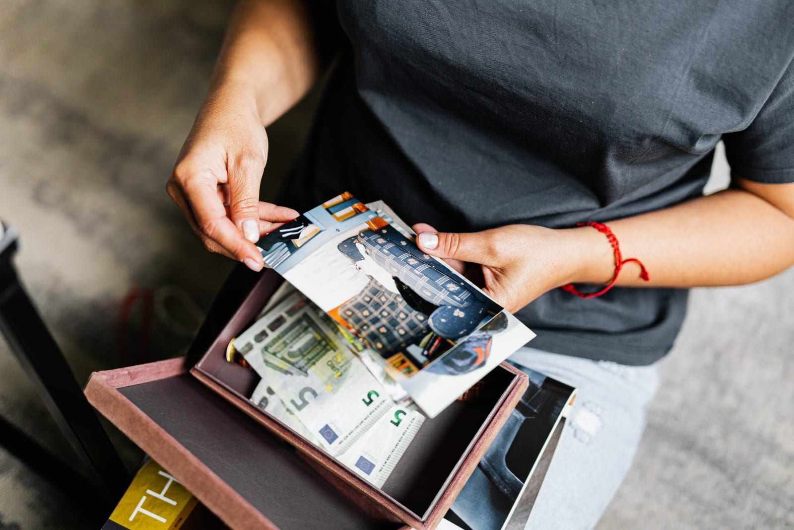 Man shuffling through stacks of old illustrated cards (Representative Image Source: Pexels | Photo by )