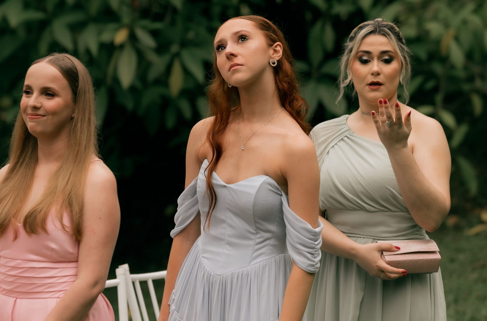 Bridesmaids making different expressions while standing in a garden (Representative Image Source: Pexels | Photo by)