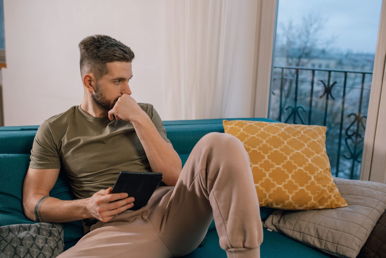 Man thinking deeply with an iPad in hand (Representative Image Source: Pexels | Photo by )