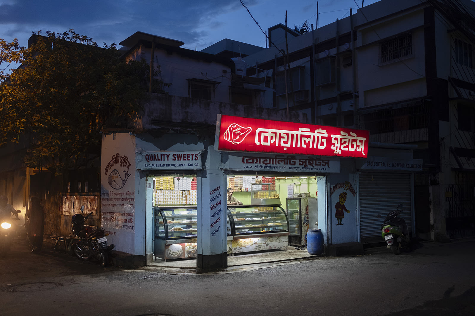 A sweet shop standing under a spotlight.