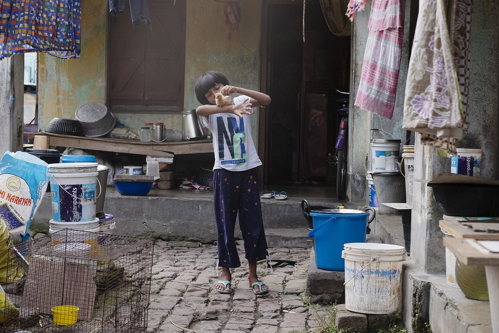 Young kid practicing how to spin a ball.